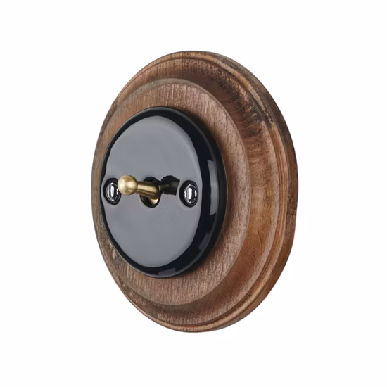 벽에 장식된 백자 소재의 원형 매립형 1구 1방향 버튼 스위치